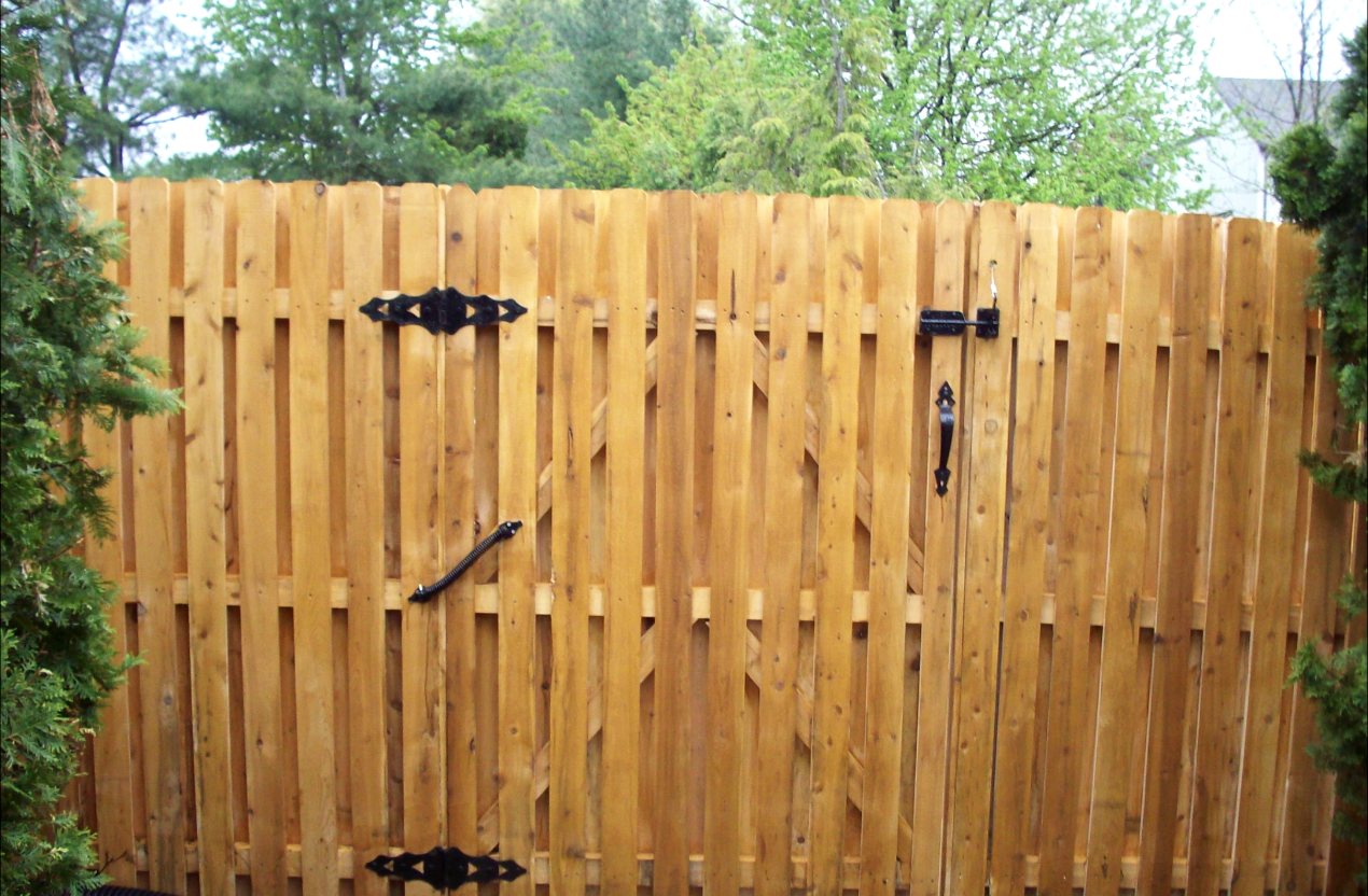 New cedar shadowbox fence with a double walk gate and black hardware, installed by NJPS Fence Company